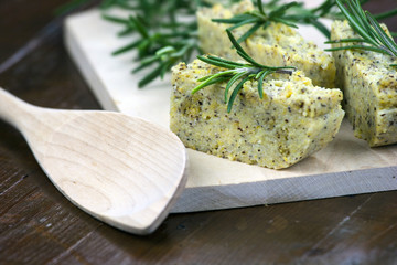 Baked polenta with italian cheese and rosemary