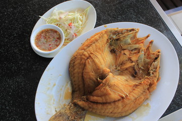 Fried snapper with chili sauce on the plate