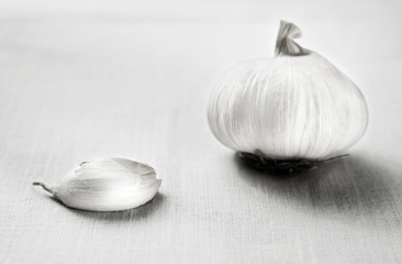 Garlic on linen cloth, selective focus