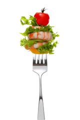 Mixed salad on fork isolated on white