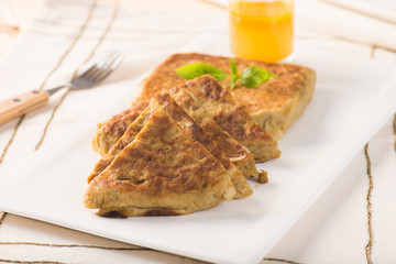 Martabak or murtabak, also mutabbaq, is a stuffed pancake is com