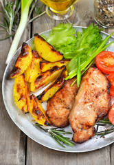 Grilled pork steak on rustic table