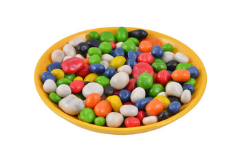 Color candy on plate, isolated on a white background