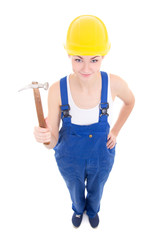 young attractive woman builder in workwear with hammer isolated