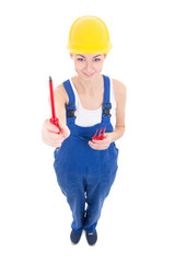 funny young attractive woman builder in workwear with screwdrive