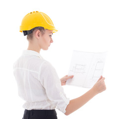 young business woman architect in yellow builder helmet with bui