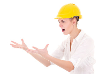 angry business woman architect in yellow builder helmet shouting