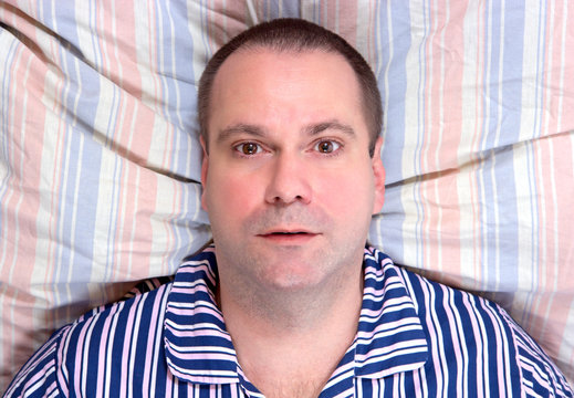 lying man resting in bed