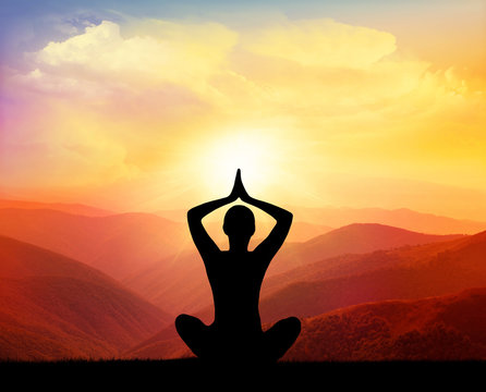 Yoga practicioner during the sunset meditation