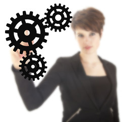 Young businesswoman with black gears isolated