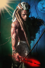 Muscular man with dreadlocks werewolf on a colorful background w