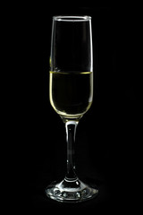 Glass of White Wine Isolated on Black Background