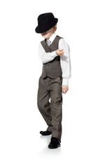Dancing boy in hat isolated on white