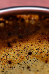 Coffee foam in a cup, photographed macro