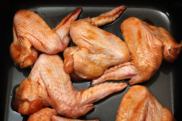 Chicken wings with sauce for baking.