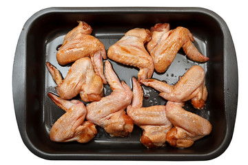 Chicken wings with sauce for baking.