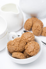 Italian cookies amaretti and crockery for teatime, vertical