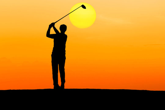 silhouette golfer playing golf on sunset
