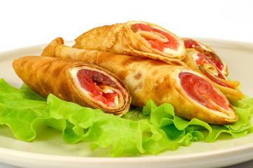 Three tortillas on a salad leaf
