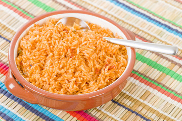 Mexican Rice - Rice cooked with tomato sauce and chicken broth.