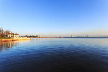 skyline and lake near resort in suburb.