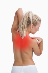 Rear view of topless woman with neck pain