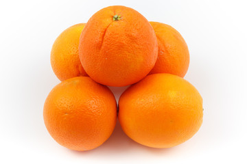 Oranges stacked as pyramid with white background