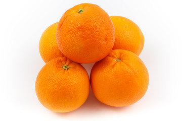 Oranges stacked as pyramid with white background