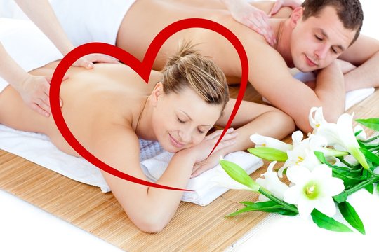 Composite image of loving young couple enjoying a back massage