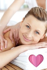 Obraz na płótnie Canvas Composite image of cheerful woman enjoying a back massage