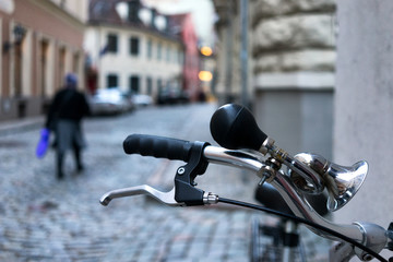 Wheel bicycle with a signal on the streets of the old city backg