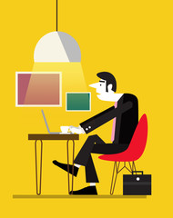 Business man using his notebook computer at a cafe table.