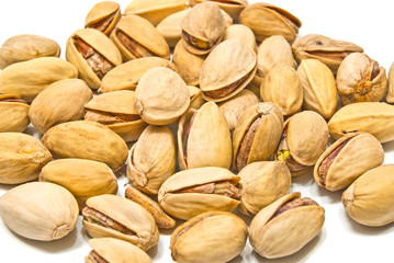 heap of tasty roasted pistachios closeup