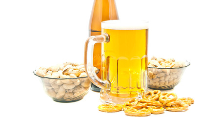 different nuts, pretzels and beer on white