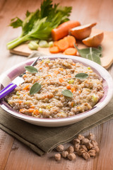 barley risotto with chickpeas and vegetables, selective focus