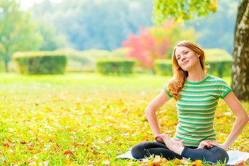 pretty girl leads a healthy lifestyle practices yoga