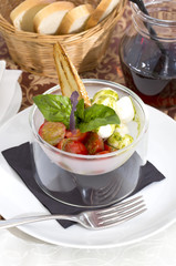 tomatoes and cheese on white plate in a restaurant