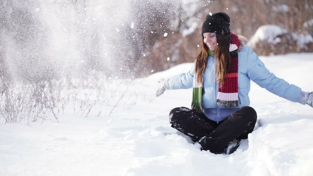 Girl playing with snow