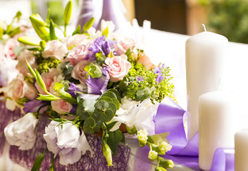 flowers and candles on celebratory table at restaurant