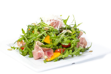 salad of arugula ham cheese on a white background