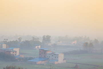 village at morning with fog