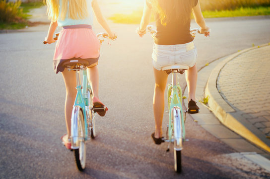 two girls riding bikes
