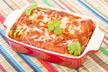 Enchiladas - Mexican tortilla with chorizo and chicken.