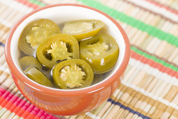 Jalapenos - Pickled sliced jalapeno chillies in a bowl