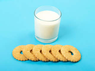 Glass of milk and cookies isolated on white