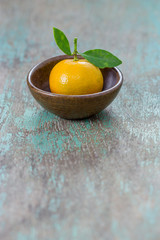 oranges (Citrus Japonica Thunb) in a ceramic dish