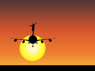 Man silhouette with plane at sunset