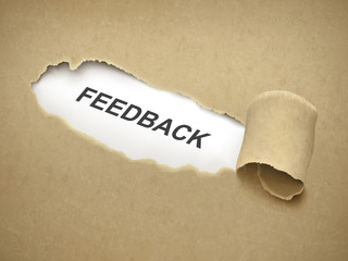 the word feedback behind torn paper