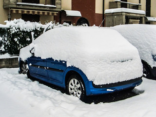 Car covered by snow after a snowfall