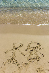 Drawing in the sand depicting love of the opposite sexes